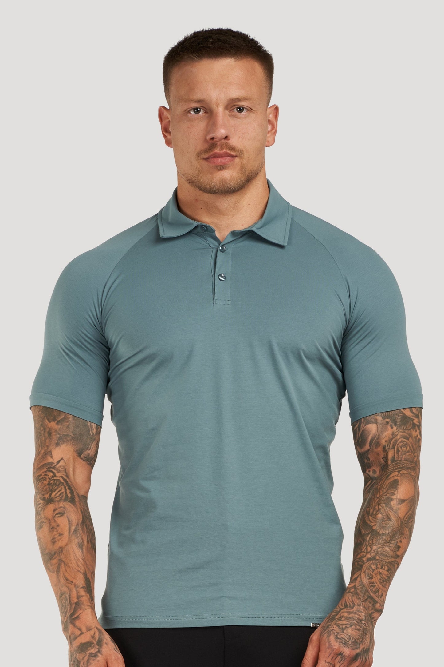 THE MUSCLE BUTTON POLO