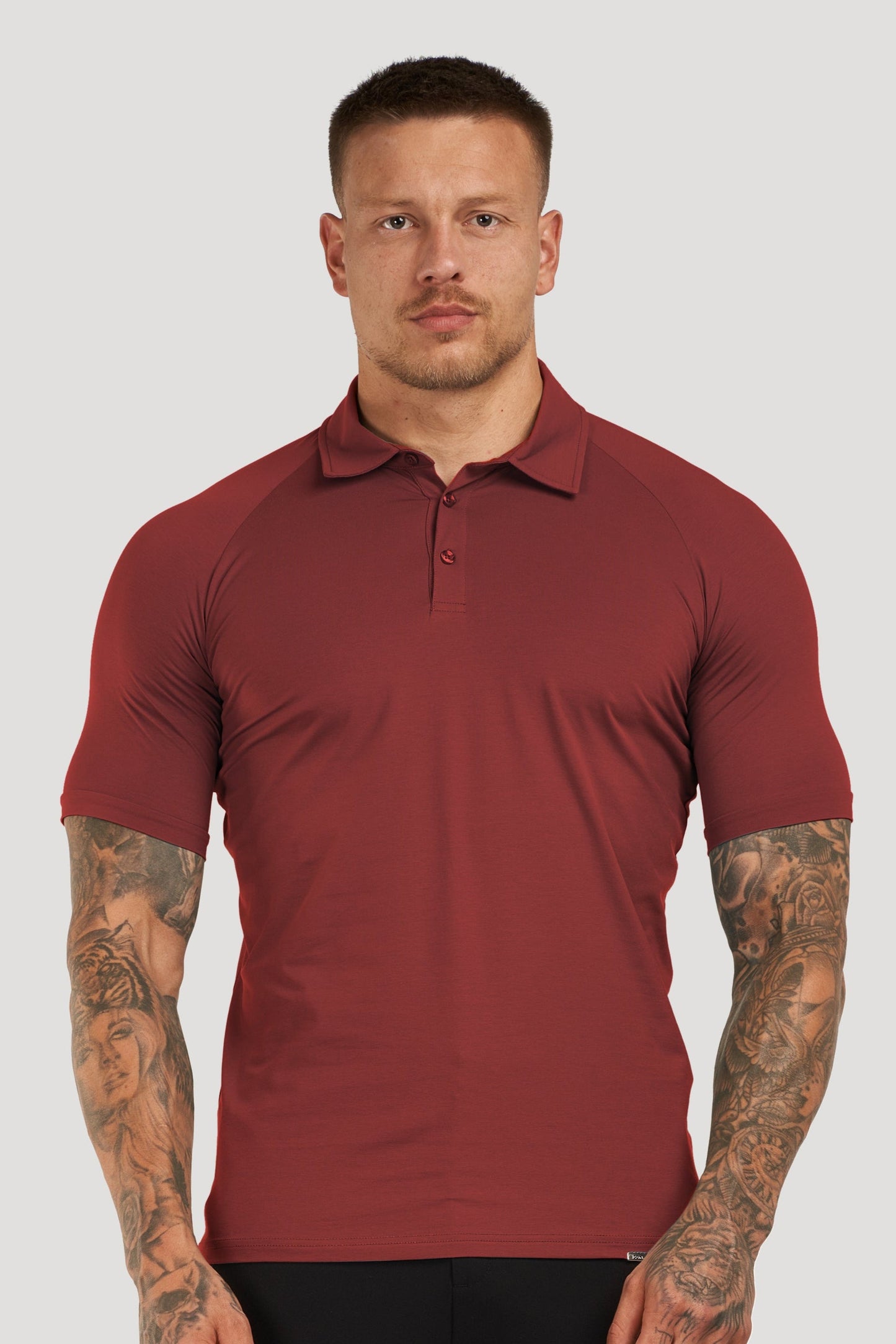 THE MUSCLE BUTTON POLO