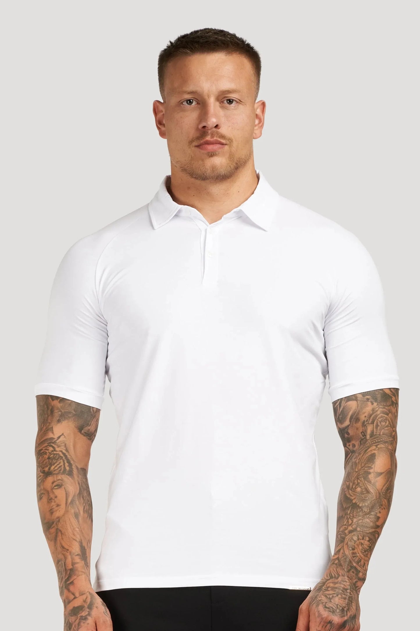 THE MUSCLE BUTTON POLO